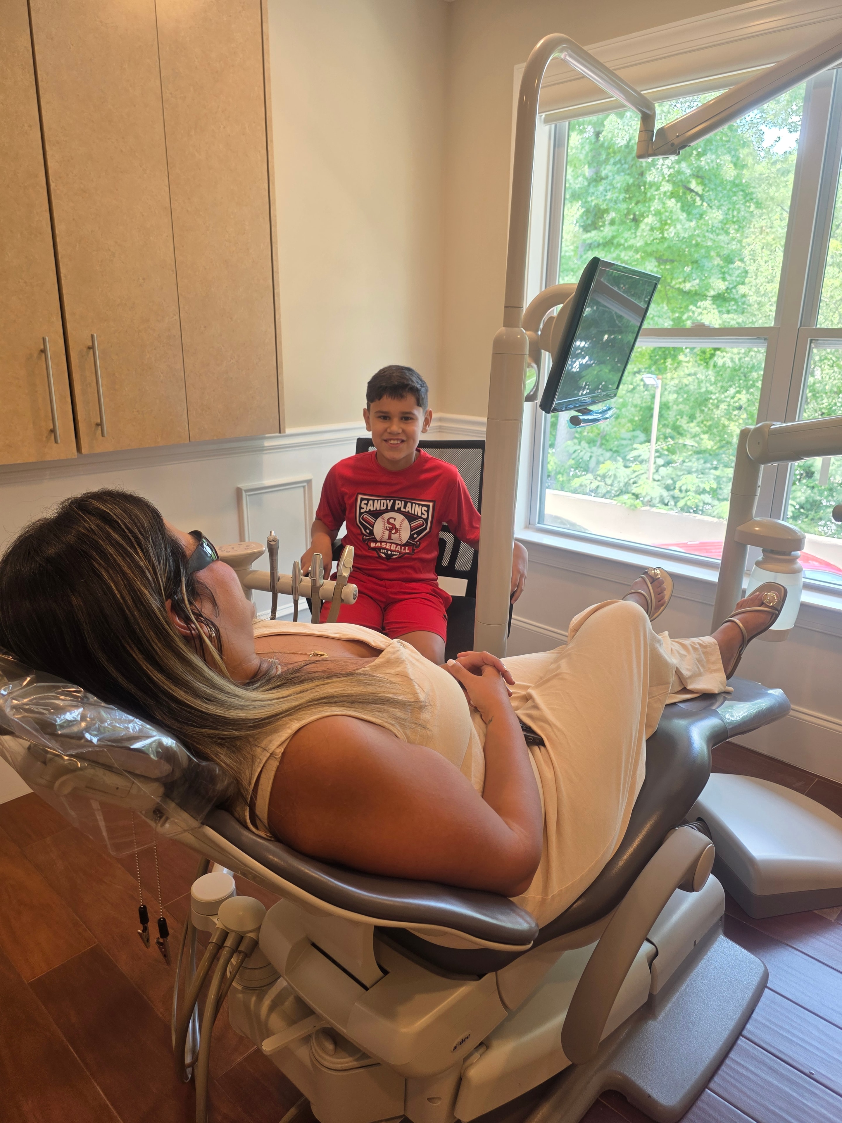 Child and parent at a family dental visit at Merchants Walk Dental in East Cobb, Marietta